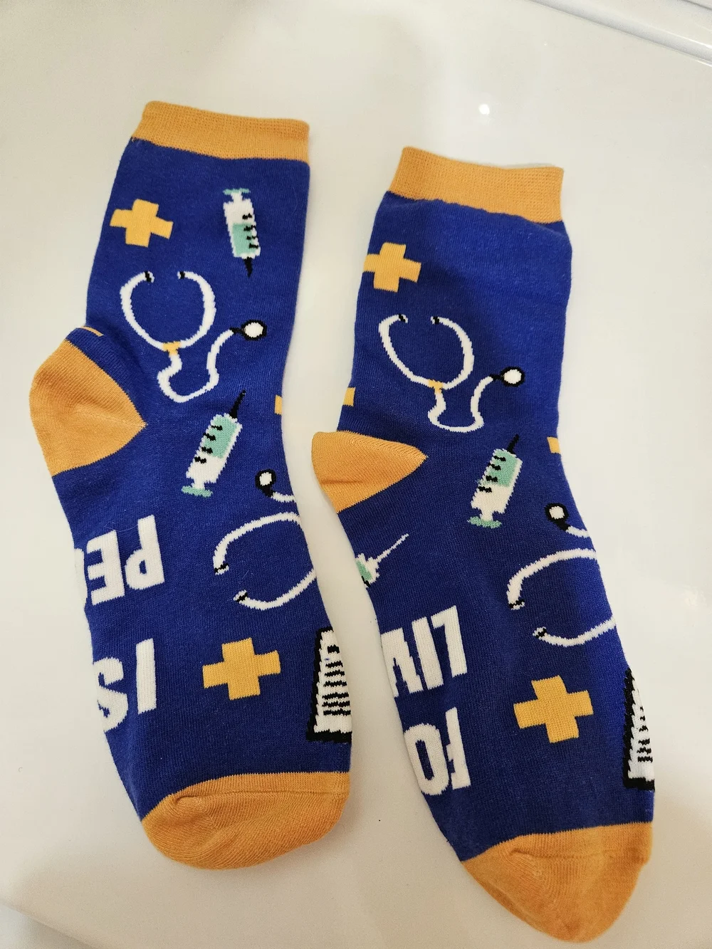 Novelty 'I Stab People For A Living' Blue & Orange Crew Socks